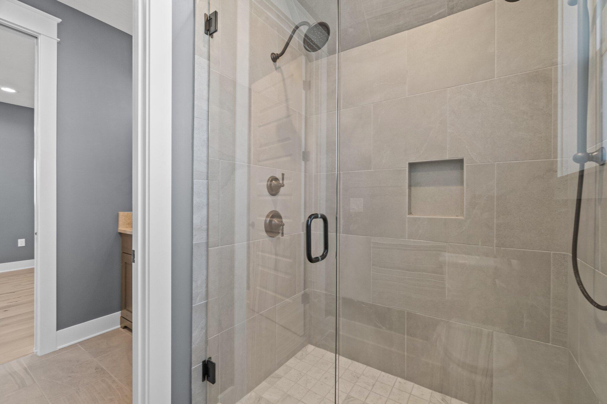 414 Ridgewalk Circle Santa Rosa Beach, FL 32459 - Photo 24 of 43 a bathroom with a glass shower door