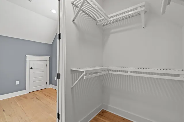 a view of a room with racks on the wall