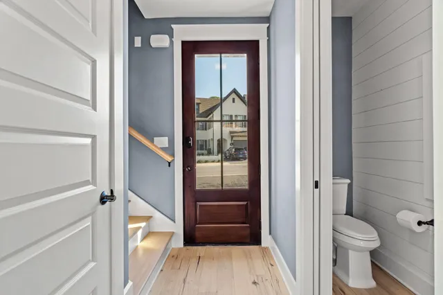 a bathroom with a toilet and a shower