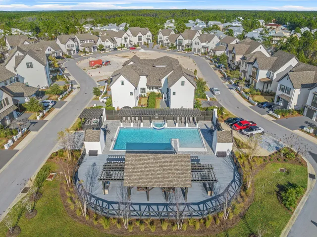an aerial view of a house with a swimming pool