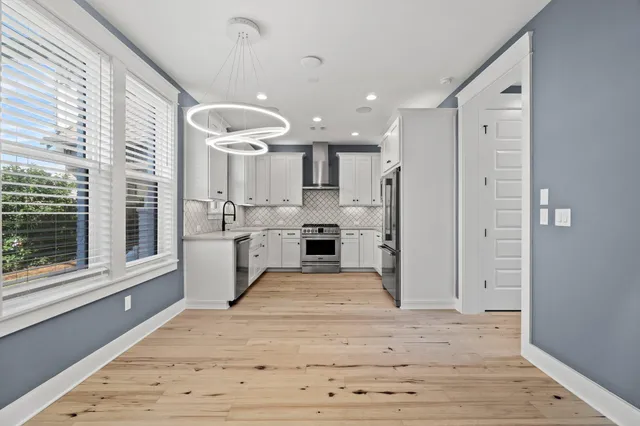 a view of kitchen with wooden floor