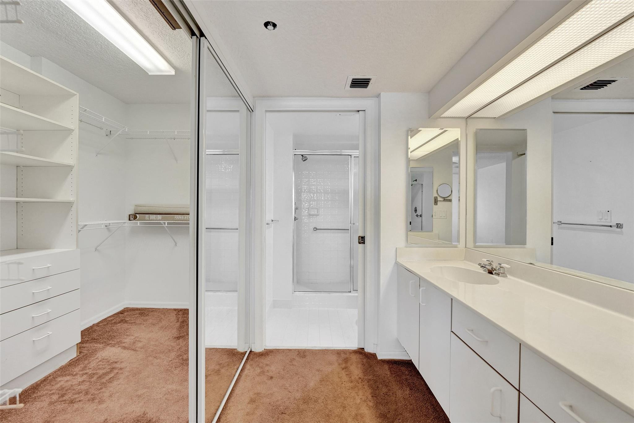 9563 Weldon Circle, Unit D212 Tamarac, FL 33321 - Photo 34 of 69 a spacious bathroom with a shower and a sink