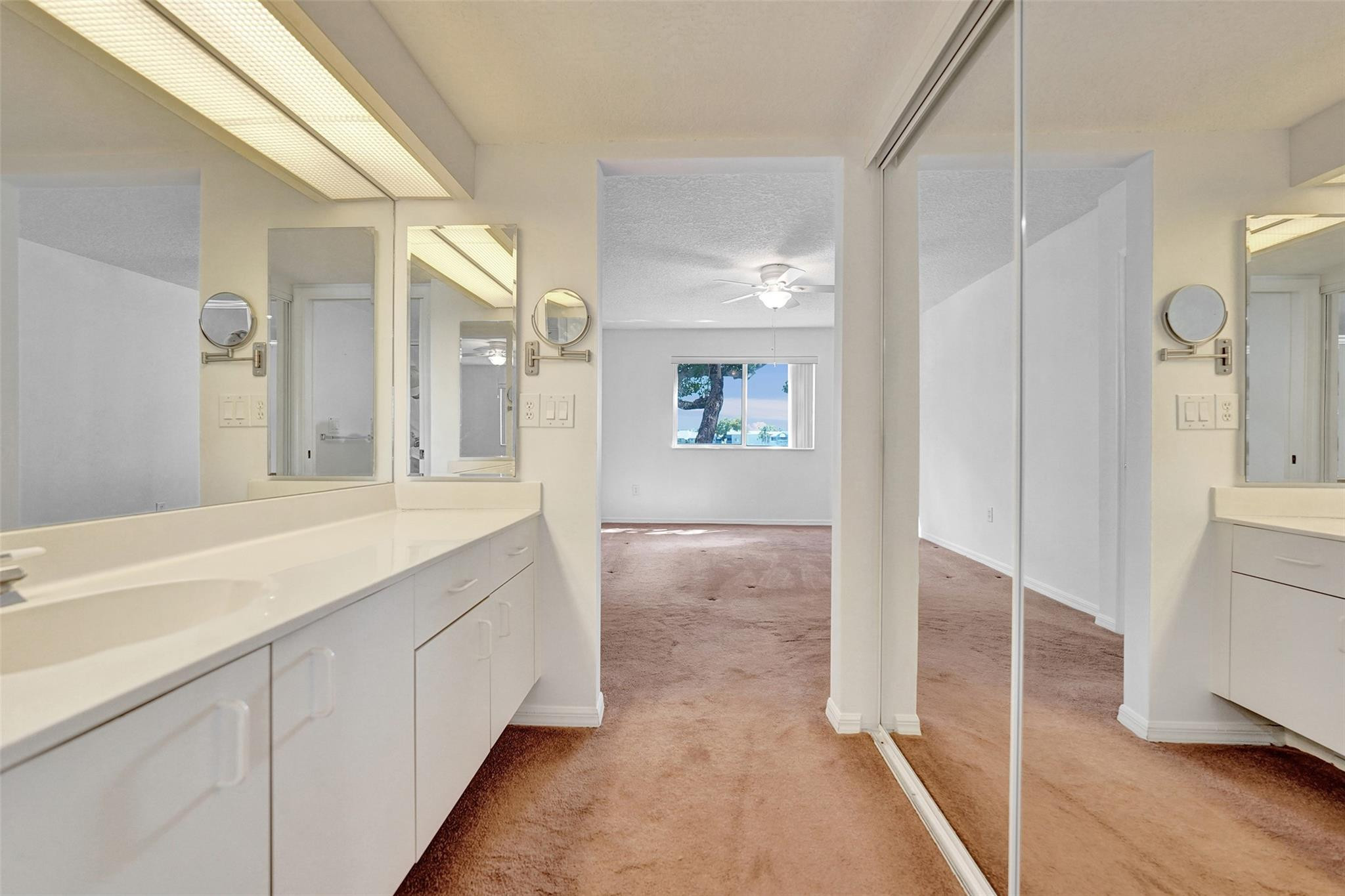 9563 Weldon Circle, Unit D212 Tamarac, FL 33321 - Photo 36 of 69 a spacious bathroom with a shower and a sink