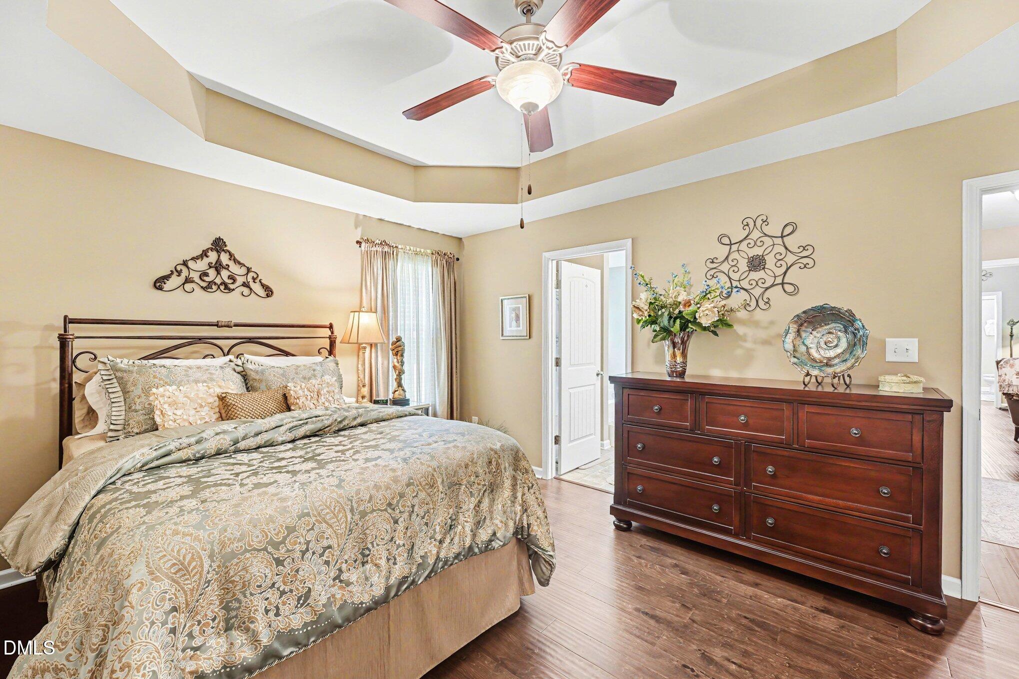109 His Way Middlesex, NC 27557 - Photo 8 of 21 a bedroom with a bed and a chandelier