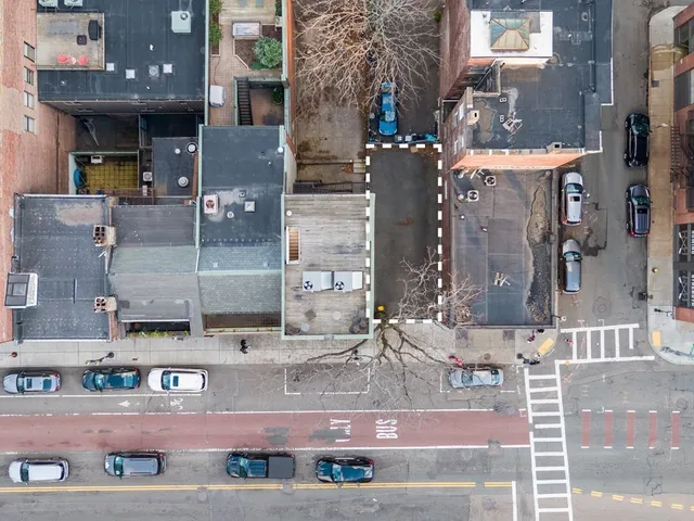 a picture of a brick building with many windows