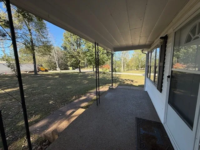 a view of a floor to ceiling window with a yard