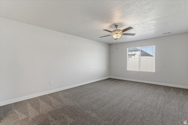 2028 West Grace Way Layton, UT 84041 - Photo 18 of 36 Unfurnished room featuring dark carpet, a ceiling fan, and a textured ceiling