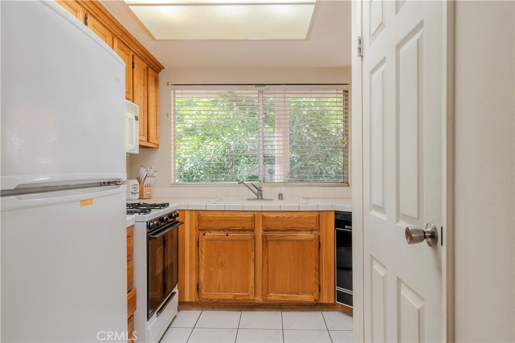 3366 Darby Street, Unit 435 Simi Valley, CA 93063 - Photo 15 of 19 a view of a kitchen with a sink and dishwasher