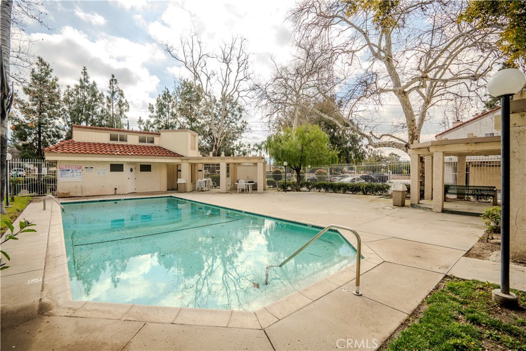 3366 Darby Street, Unit 435 Simi Valley, CA 93063 - Photo 16 of 19 a view of a white house with a yard