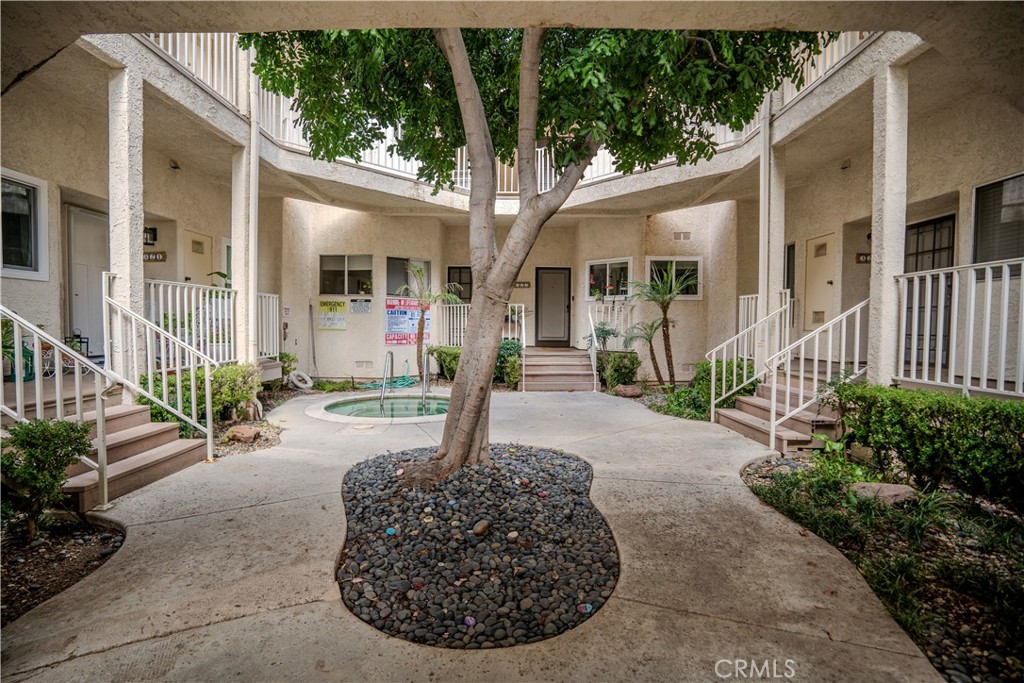 3366 Darby Street, Unit 435 Simi Valley, CA 93063 - Photo 5 of 19 a front view of a house with garden