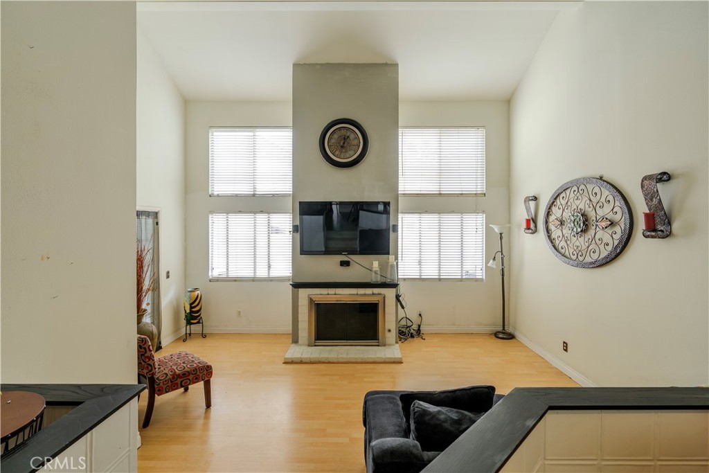 3366 Darby Street, Unit 435 Simi Valley, CA 93063 - Photo 6 of 19 a living room with furniture and a fireplace