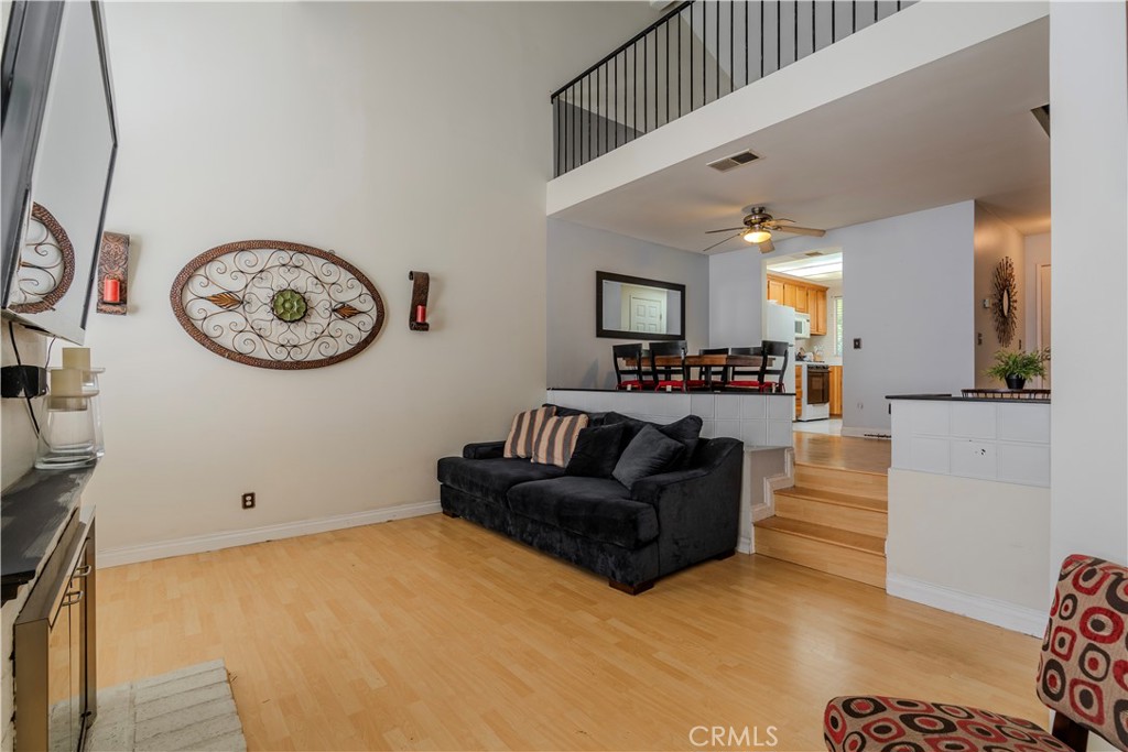 3366 Darby Street, Unit 435 Simi Valley, CA 93063 - Photo 8 of 19 a living room with furniture and a clock