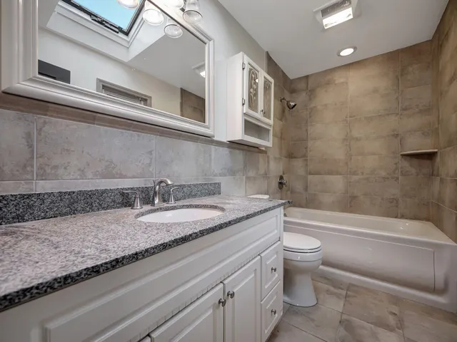 a view of an empty room with windows