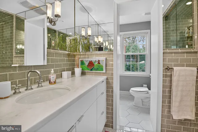 a bathroom with a sink and a window