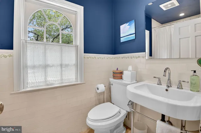 a view of a hallway and a hallway with wooden floor