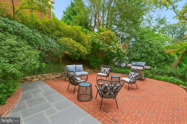 a view of a chair and table in the balcony