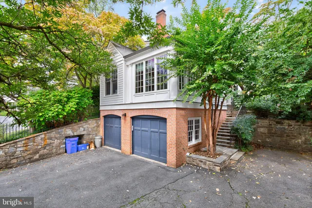a view of a backyard with sitting area