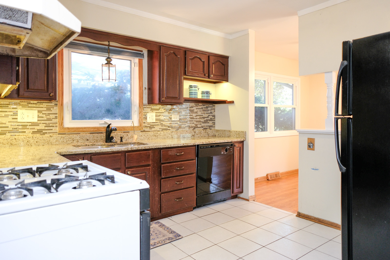 S586 East Street Winfield, IL 60190 - Photo 11 of 29 a kitchen with a refrigerator and a sink