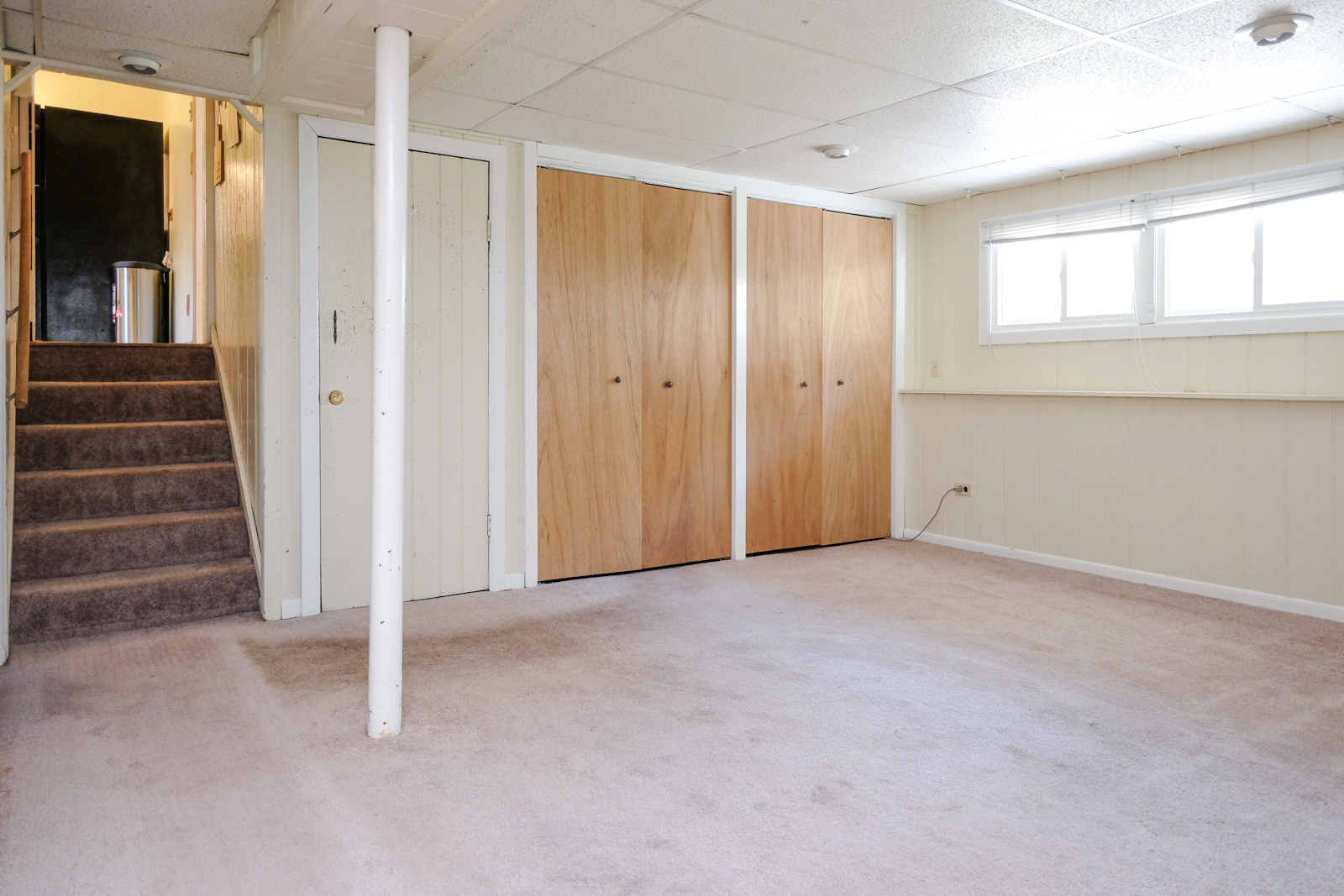 S586 East Street Winfield, IL 60190 - Photo 13 of 29 a view of an empty room with stairs and a window