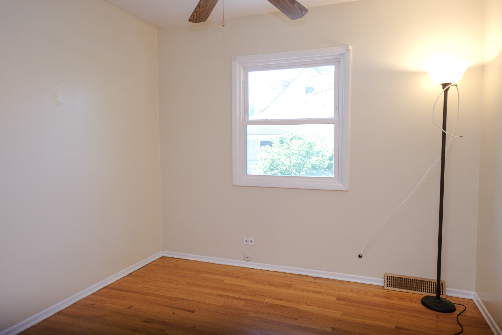 S586 East Street Winfield, IL 60190 - Photo 26 of 29 an empty room with wooden floor and windows