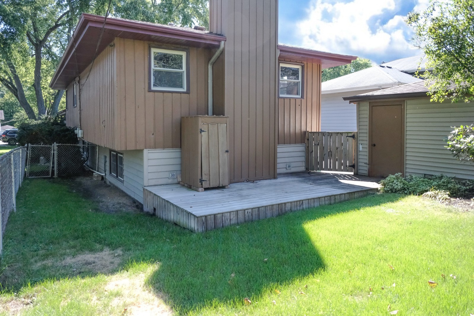 S586 East Street Winfield, IL 60190 - Photo 28 of 29 a view of a house with a yard and sitting area