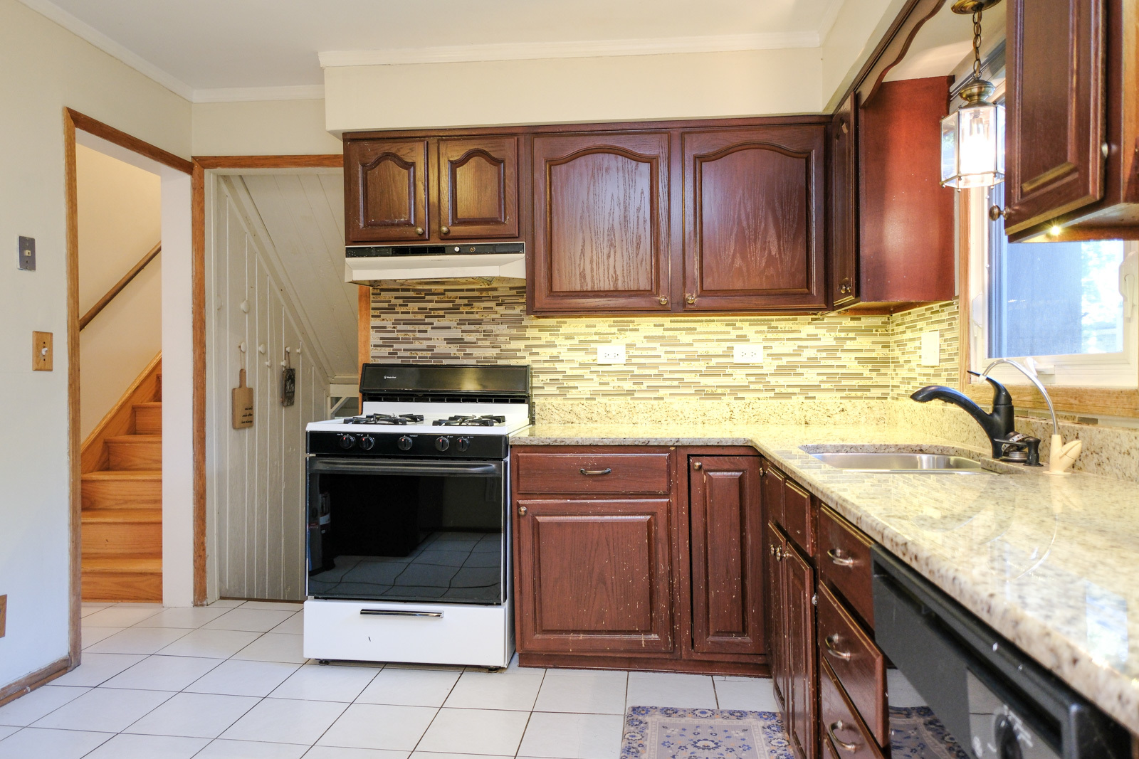 S586 East Street Winfield, IL 60190 - Photo 10 of 29 a kitchen with stainless steel appliances granite countertop a stove sink and cabinets
