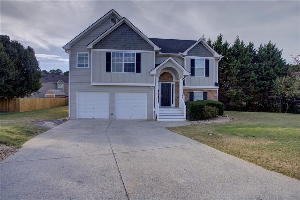 19 Independence Way Northeast Cartersville, GA 30121 - Photo 1 of 1 a front view of a house with a yard and garage