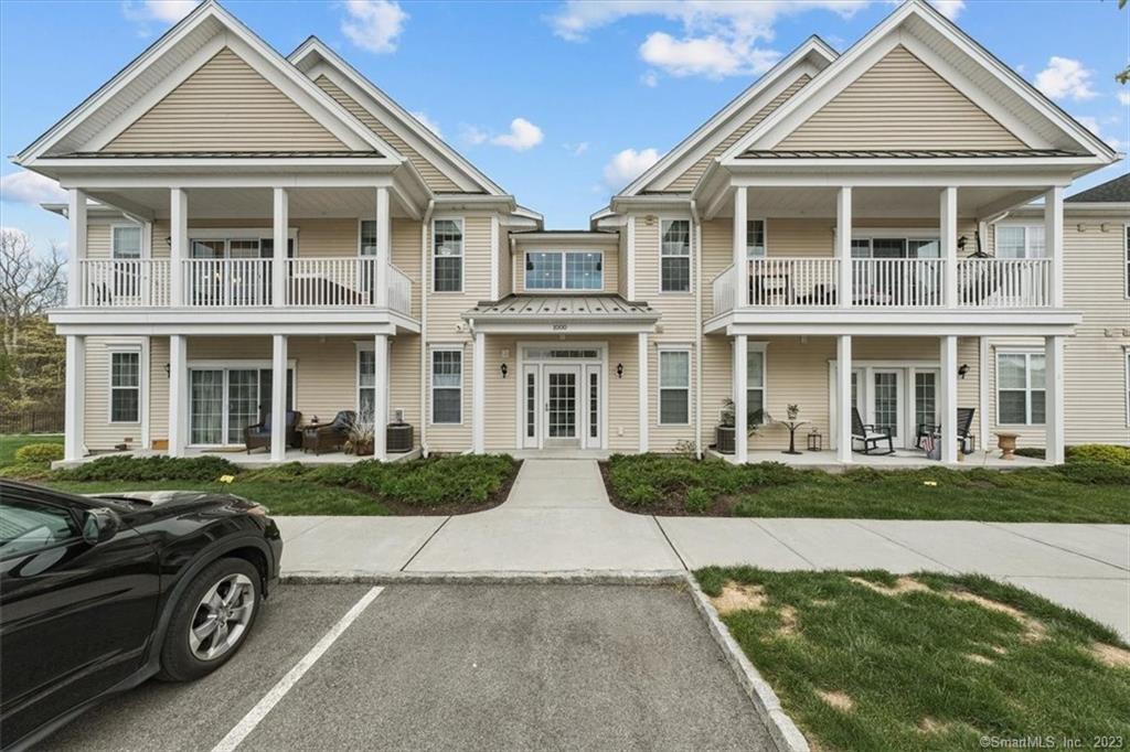 1028 Country View Road, Unit 1028 Danbury, CT 06810 - Photo 1 of 26 front view of a brick house with a yard