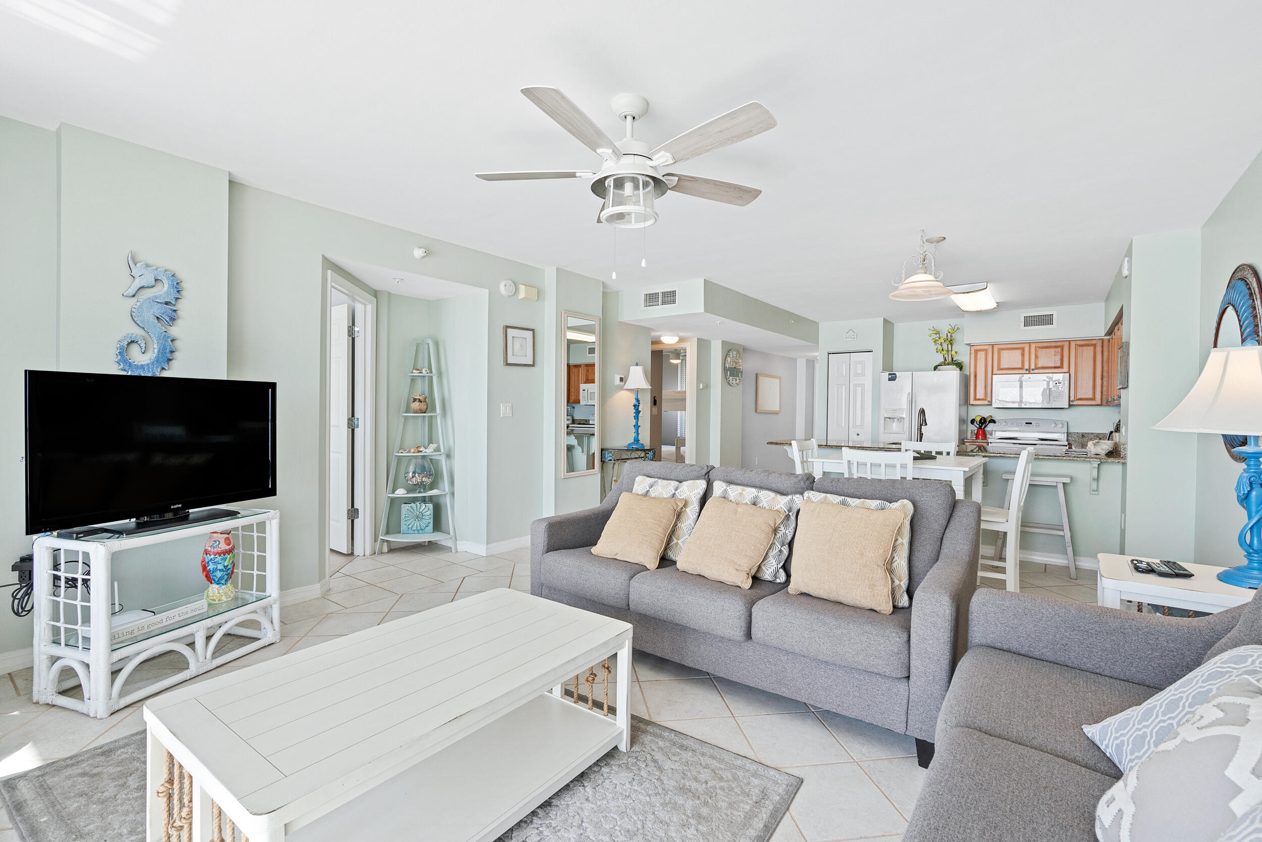 520 Santa Rosa Boulevard, Unit 705 Fort Walton Beach, FL 32548 - Photo 12 of 36 a living room with furniture and a flat screen tv