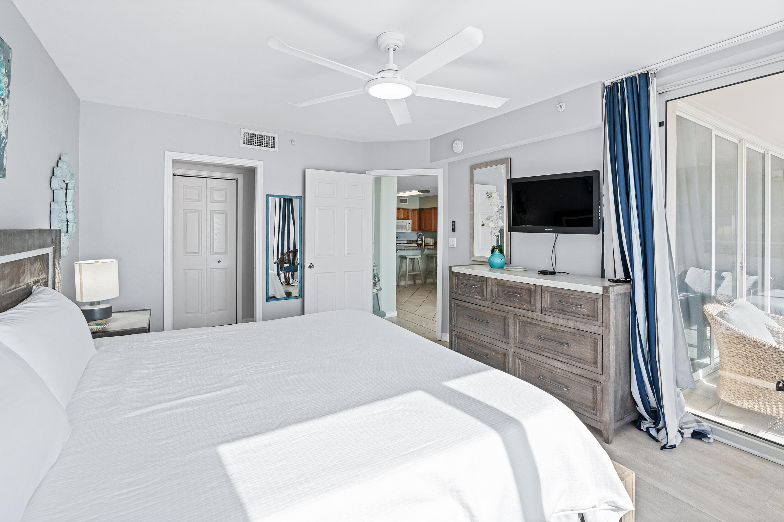 520 Santa Rosa Boulevard, Unit 705 Fort Walton Beach, FL 32548 - Photo 15 of 36 a bedroom with a flat screen television and a bed