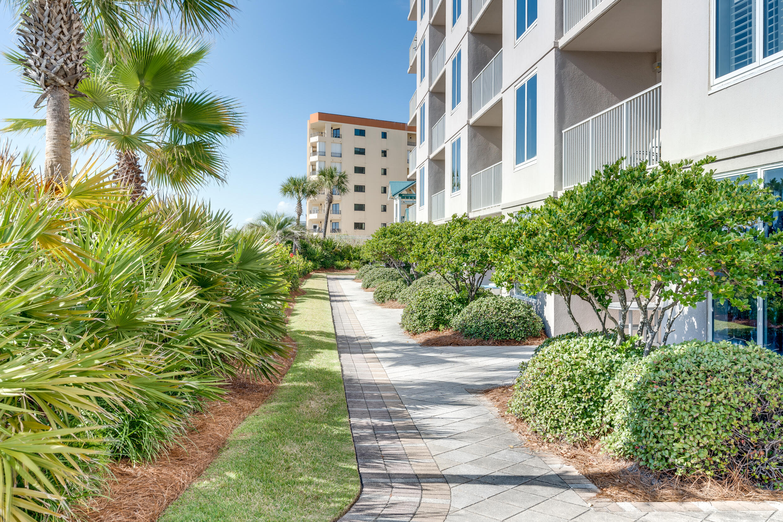 520 Santa Rosa Boulevard, Unit 705 Fort Walton Beach, FL 32548 - Photo 24 of 36 a front view of a multi story building with yard