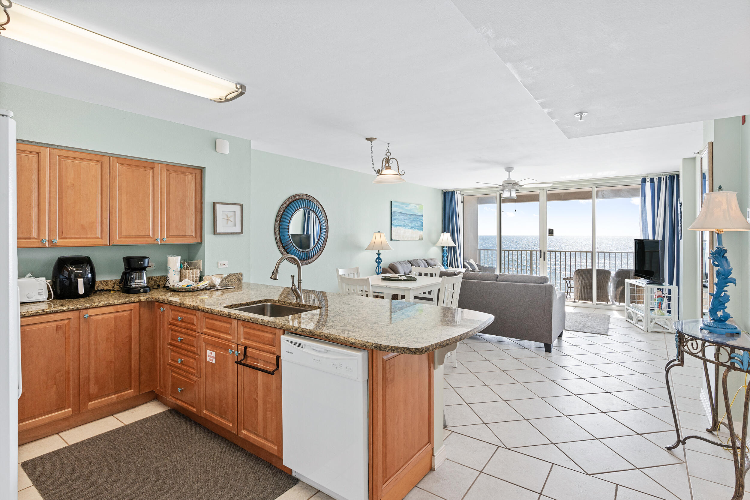 520 Santa Rosa Boulevard, Unit 705 Fort Walton Beach, FL 32548 - Photo 3 of 36 a kitchen with granite countertop a sink and white cabinets