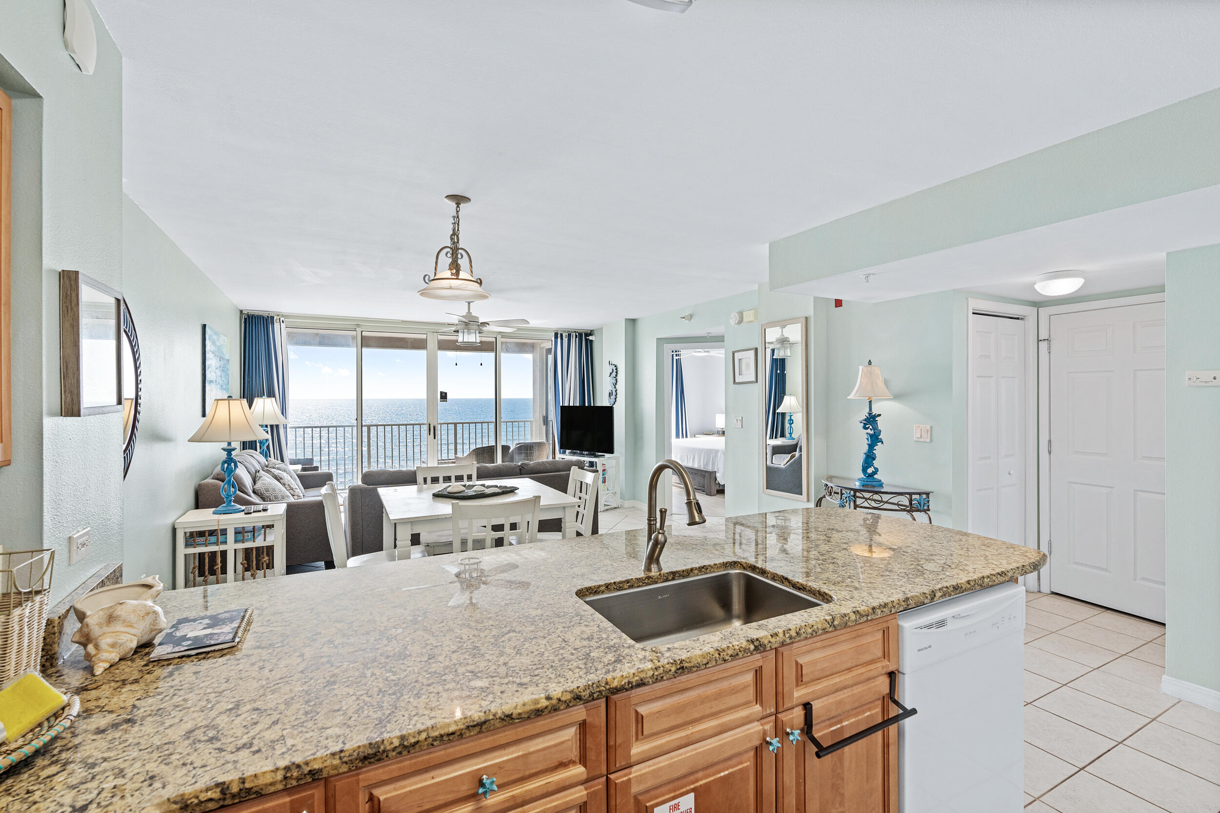 520 Santa Rosa Boulevard, Unit 705 Fort Walton Beach, FL 32548 - Photo 6 of 36 a view of a kitchen counter top space and living room