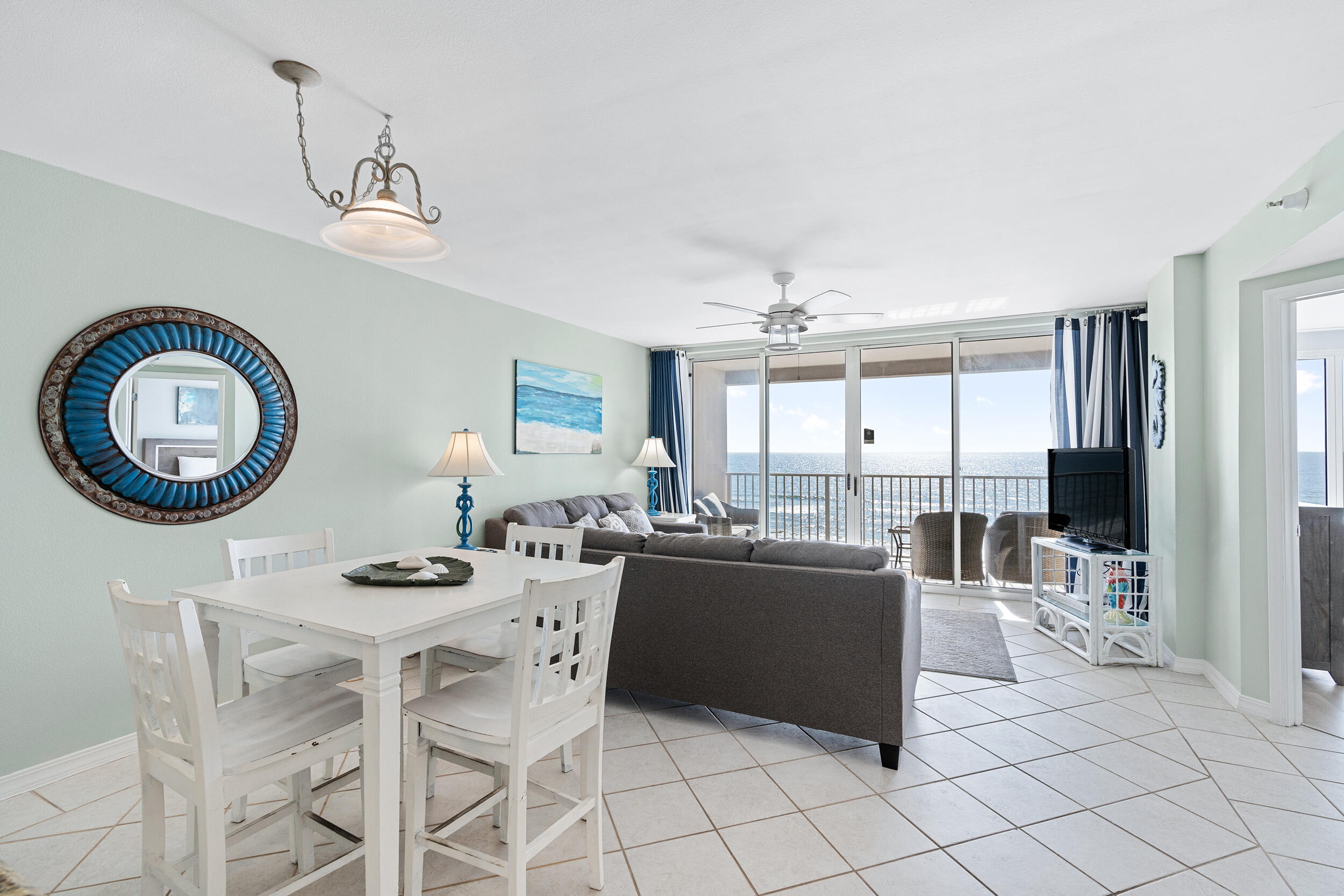 520 Santa Rosa Boulevard, Unit 705 Fort Walton Beach, FL 32548 - Photo 8 of 36 a living room with furniture a large window and a clock