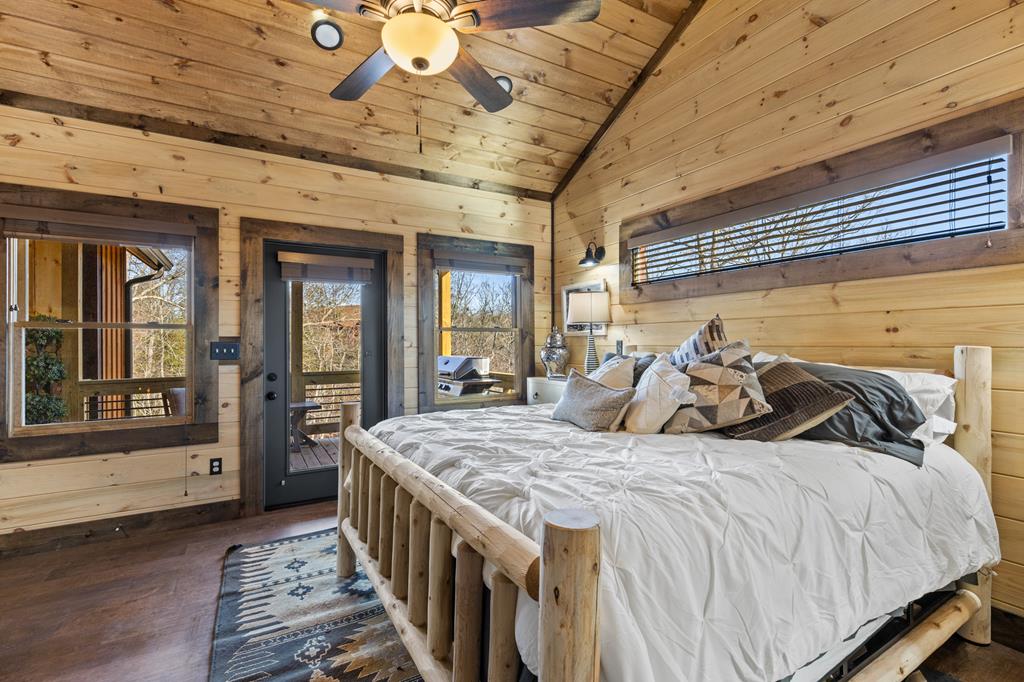 108 Shalom Lane Blue Ridge, GA 30513 - Photo 18 of 62 a bedroom with bed and wooden floor