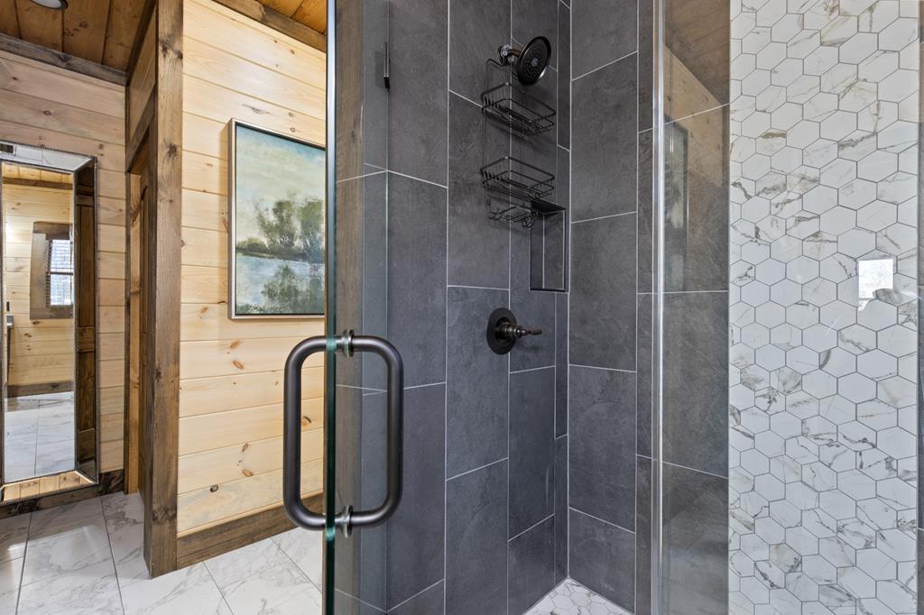 108 Shalom Lane Blue Ridge, GA 30513 - Photo 25 of 62 a bathroom with a tub and shower