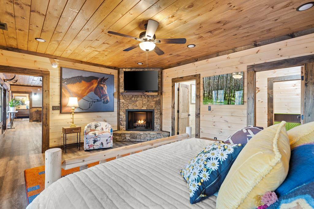 108 Shalom Lane Blue Ridge, GA 30513 - Photo 50 of 62 a spacious bedroom with a bed and glass windows