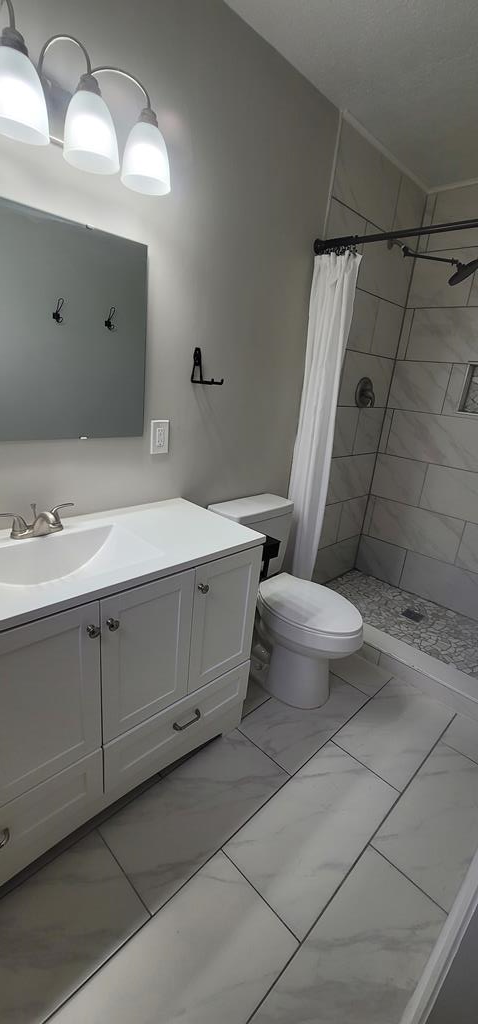 3327 College Avenue Columbus, GA 31907 - Photo 11 of 29 a bathroom with a double vanity sink toilet and shower