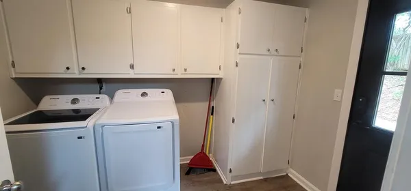 a utility room with dryer and washer