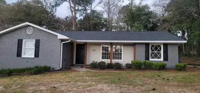 a front view of a house with garden