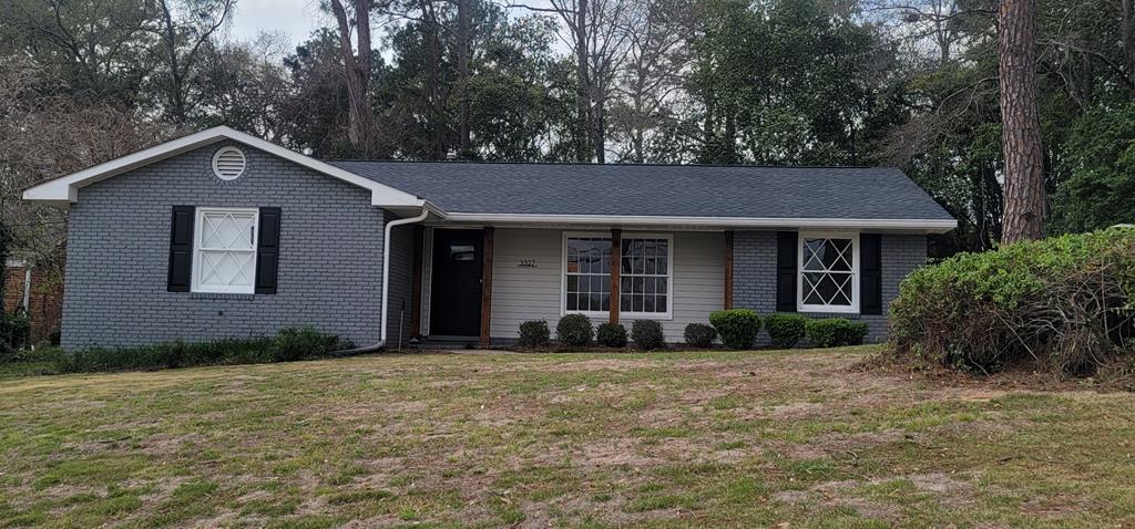 3327 College Avenue Columbus, GA 31907 - Photo 25 of 29 a front view of a house with a garden