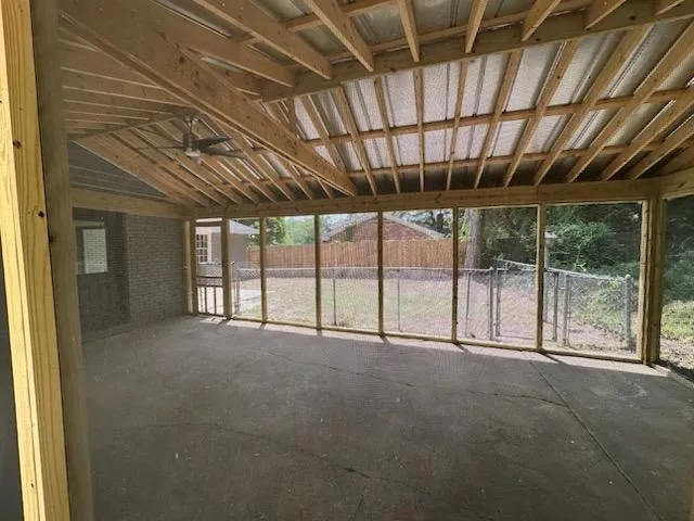 a view of an empty room with a sliding door