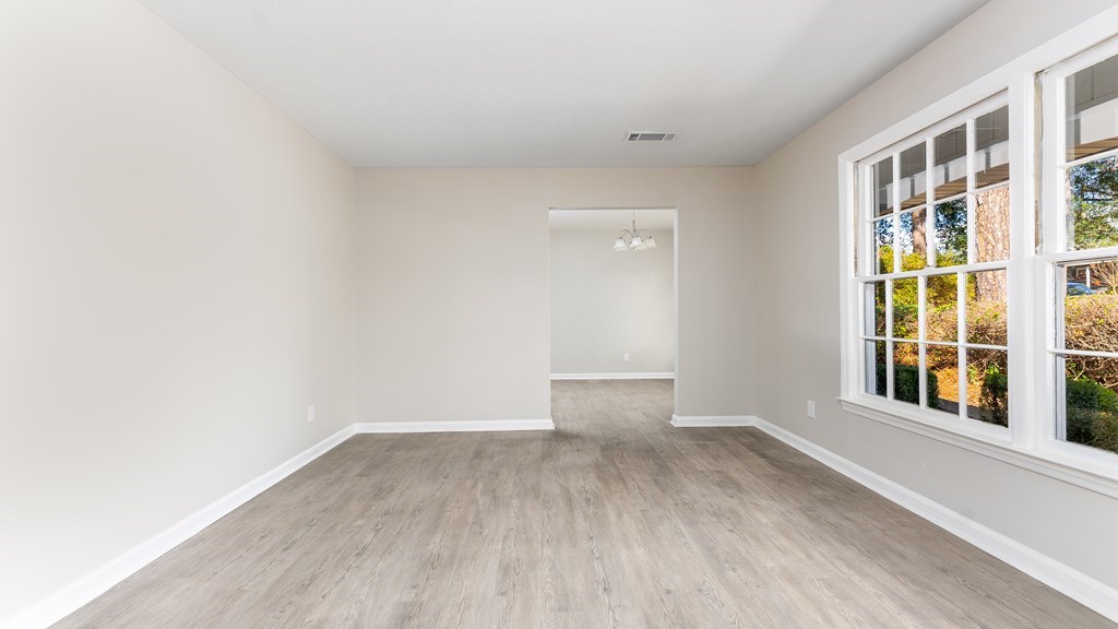 3327 College Avenue Columbus, GA 31907 - Photo 4 of 29 a view of empty room with wooden floor and fan