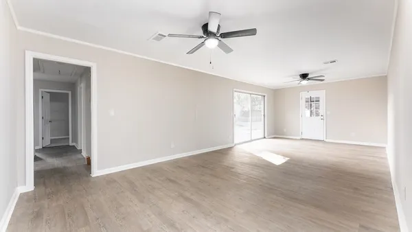 a view of an empty room with a window