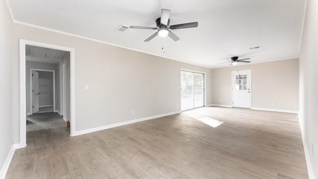 a view of an empty room with a window