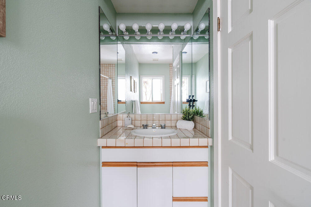 2484 Page Drive Altadena, CA 91001 - Photo 12 of 27 a bathroom with a sink and a mirror