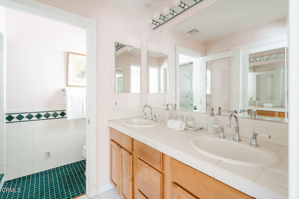 2484 Page Drive Altadena, CA 91001 - Photo 15 of 27 a bathroom with a double vanity sink and a mirror