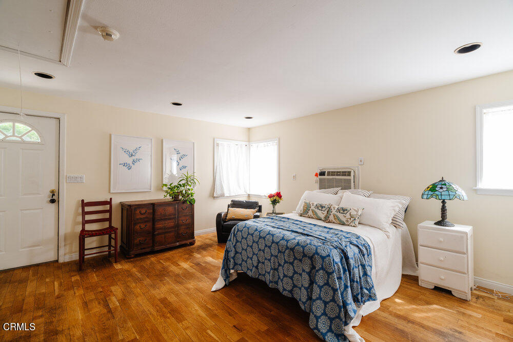 2484 Page Drive Altadena, CA 91001 - Photo 22 of 27 a bedroom with a bed and dresser