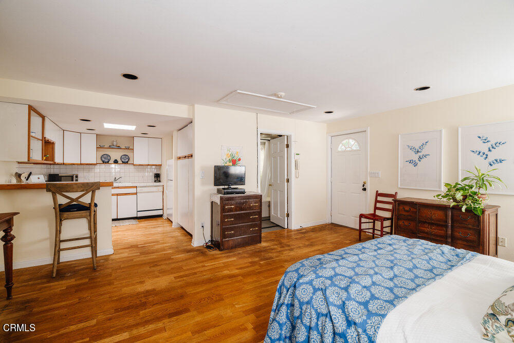 2484 Page Drive Altadena, CA 91001 - Photo 25 of 27 a bedroom with a bed and a view of kitchen