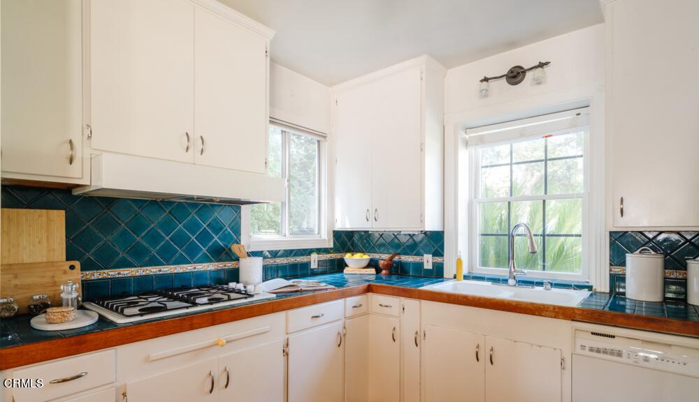 2484 Page Drive Altadena, CA 91001 - Photo 8 of 27 a kitchen with sink cabinets and window